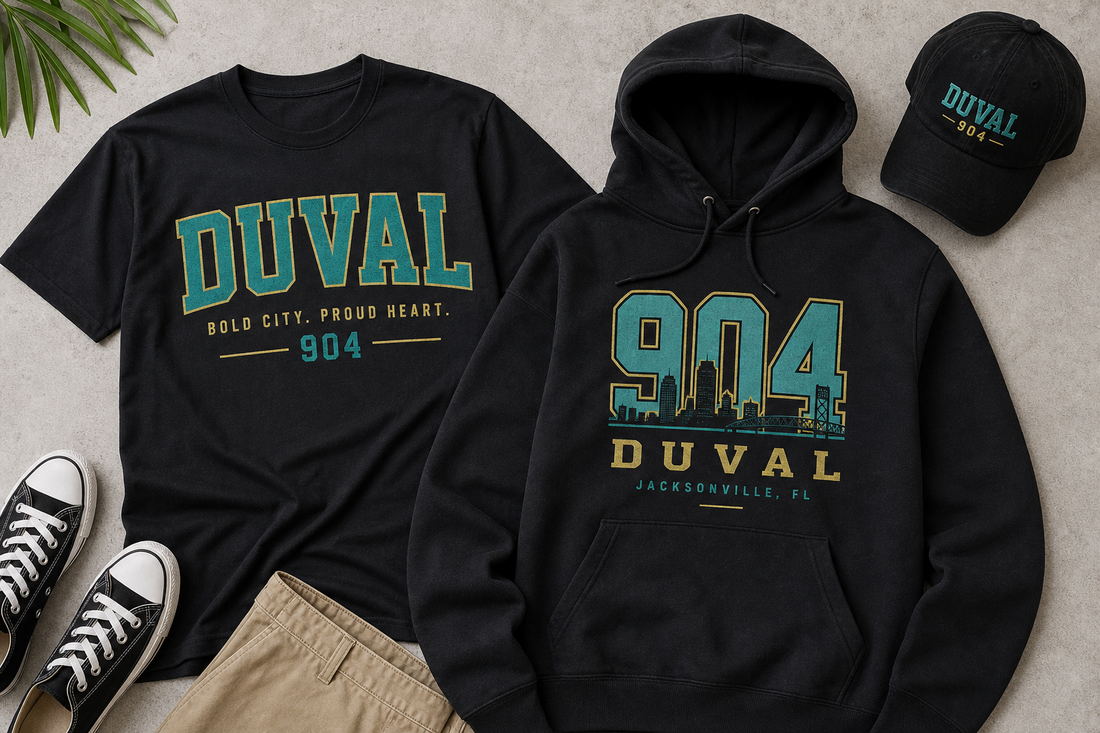 Graphic tee and hoodie with Duval and Jacksonville-inspired pride design elements laid flat on a neutral surface.